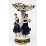 A large Royal Dux Bohemia porcelain centrepiece: modelled with three barefoot girls dancing around