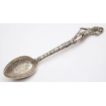 A South American silver spoon: with foliate decorated bowl,