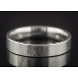 A platinum wedding band:, approximately 6.5gms.