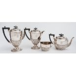 A George V silver four-piece part tea and coffee service, maker Walker and Hall Sheffield,