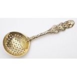 A George IV silver gilt sifting spoon maker SM possibly Samuel Wheatley, London,