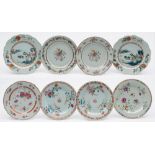 Eight Chinese porcelain famille rose plates: comprising a pair enamelled with peony and other