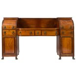 A Regency mahogany and ebony lined pedestal sideboard: of bowed breakfront outline,