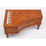 A figured bird's eye maple veneered musical box: in the form of a miniature grand piano,