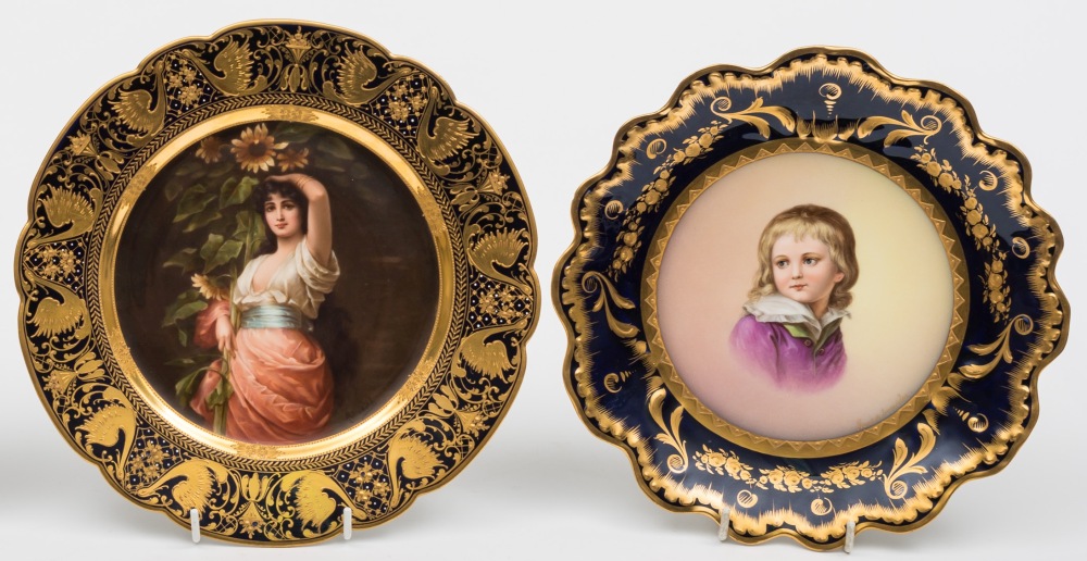 Two Vienna-style porcelain plates: one painted with a portrait of a girl titled 'Sonnenblumen',