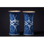 A pair of Chinese blue and white sleeve vases: painted with lotus blooms between bold ruyi-head and