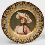 A Vienna-style porcelain plate: painted with a portrait of the 'Queen of the Roses',