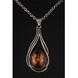 A modernist amber coloured, single stone pendant: with London import marks, on circular link chain.