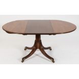 A 19th Century mahogany oval extending dining table:, in the Regency manner,