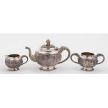 An Indian silver three-piece tea service: of circular outline,