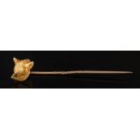 A late 19th or early 20th century gold fox mask stick-pin: the cast gold fox mask 14mm long x 12.