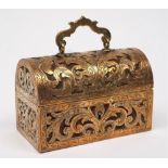 A pierced brass jewellery casket: with domed hinged lid having engraved foliate and pierced