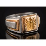 A French platinum and gold seal ring: with armorial intaglio, ring size W, 26.7gms gross weight.