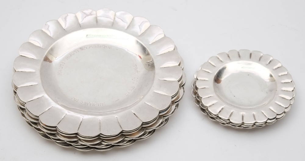 Ten Ecuadorian silver side plates and five butter plates: of circular form with wavy edge borders,