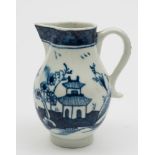 A Lowestoft blue and white 'sparrow-beak' cream jug: painted with a chinoiserie lake landscape with