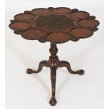 A 19th Century carved mahogany occasional table:, in the Chippendale taste,