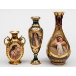 A group of three Vienna-style vases: of baluster form, one with foliate scroll handles,