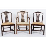 A set of eight late 19th Century carved mahogany dining chairs in the Hepplewhite taste:,