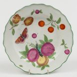 A Chelsea porcelain plate: of circular form enamelled in colours with plums, cherries,