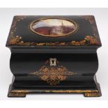 A 19th century papier mache lacquer tea caddy: the hinged lid inset with an oval painted scene of a