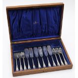 A cased set of George V silver fish knives and forks, maker Atkin Brothers, Sheffield,