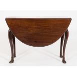 A George II mahogany oval drop flap dining table:, the hinged top with a moulded edge,