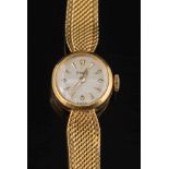 A lady's 18ct gold 'Piaget' wristwatch: the circular dial with tapered baton markers and on 18ct