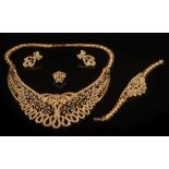 A suite of gem-set jewellery: of scroll open work design comprising a collar necklace,