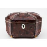 A 19th century tortoiseshell tea caddy: of rectangular outline, with recessed canted corners,