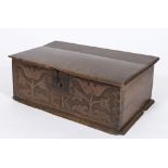 An early 18th century oak rectangular bible box: with a plain hinged top and blind fret carved