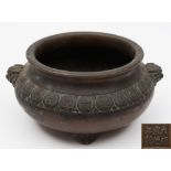 A Chinese bronze tripod censer: of compressed circular form,