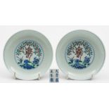 A pair of Chinese doucai saucer dishes: each enamelled with a peach branch,