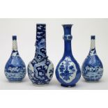 A group of four Chinese blue and white bottle vases: comprising a pair painted with fortified