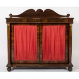 A Regency rosewood chiffonier:, with a shaped ledge back and beaded frieze,