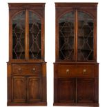 Two matching early 19th Century mahogany secretaire bookcases:,