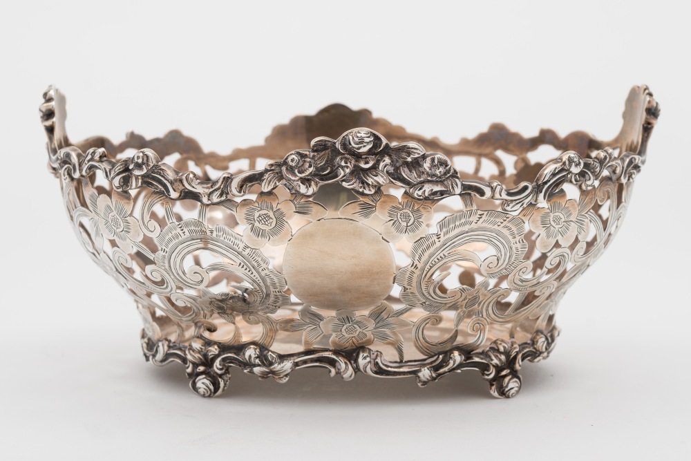 An Edward VII silver basket, maker Carrington & Co, London, 1901: of oval outline,