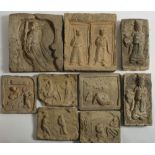 A group of nine Chinese earthenware tiles: variously moulded in relief with warriors,