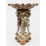 A Hugo Lonitz majolica figural comport of generous proportions: modelled with three figures in