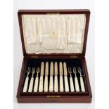 A George V set of twelve mother of pearl and silver fruit knives and forks, maker Mappin & Webb,