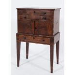 An early 19th Century mahogany and inlaid shell collector's cabinet:, bordered with boxwood lines,