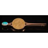 A sovereign dated '1912', mounted on a bar brooch: terminated with a single oval opal.