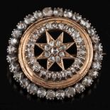 A rose diamond mounted circular brooch: with central star shaped cluster,