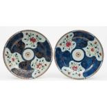 A pair of Chinese famille rose chargers: each of circular form decorated with six asymmetric panels