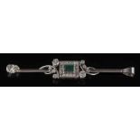 An emerald and diamond bar brooch converted to a pendant: with central rectangular emerald 5mm long