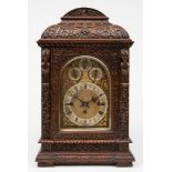 A Victorian carved oak chiming bracket clock: the eight-day duration,