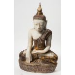 A large alabaster and polychrome decorated buddha statue: in traditional robes,