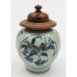 A Chinese Doucai porcelain globular jar: painted with two lotus shaped panels of fruiting peach and