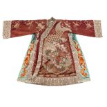 A Chinese embroidered silk coat: the front and back panels decorated with stylised fish with