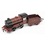 Hornby , a Type 501 0-4-0 clockwork locomotive No 5600 with four wheel tender: in LMS maroon livery.
