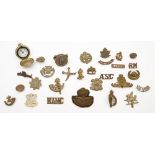 A small collection of various cap and shoulder badges together with a pocket compass:,